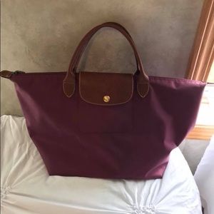 Medium size short handle Longchamp bag magenta